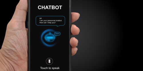 A man's hand holding mobile smartphone with chatterbot application for online information. Digital chatbot, conversational agents, robot app, conversation assistant. AI Artificial intelligence concept